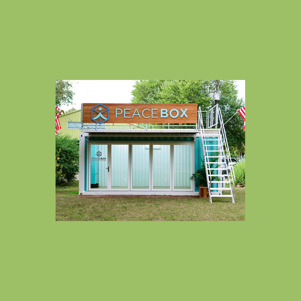 A large blue container with a sign on top of it.