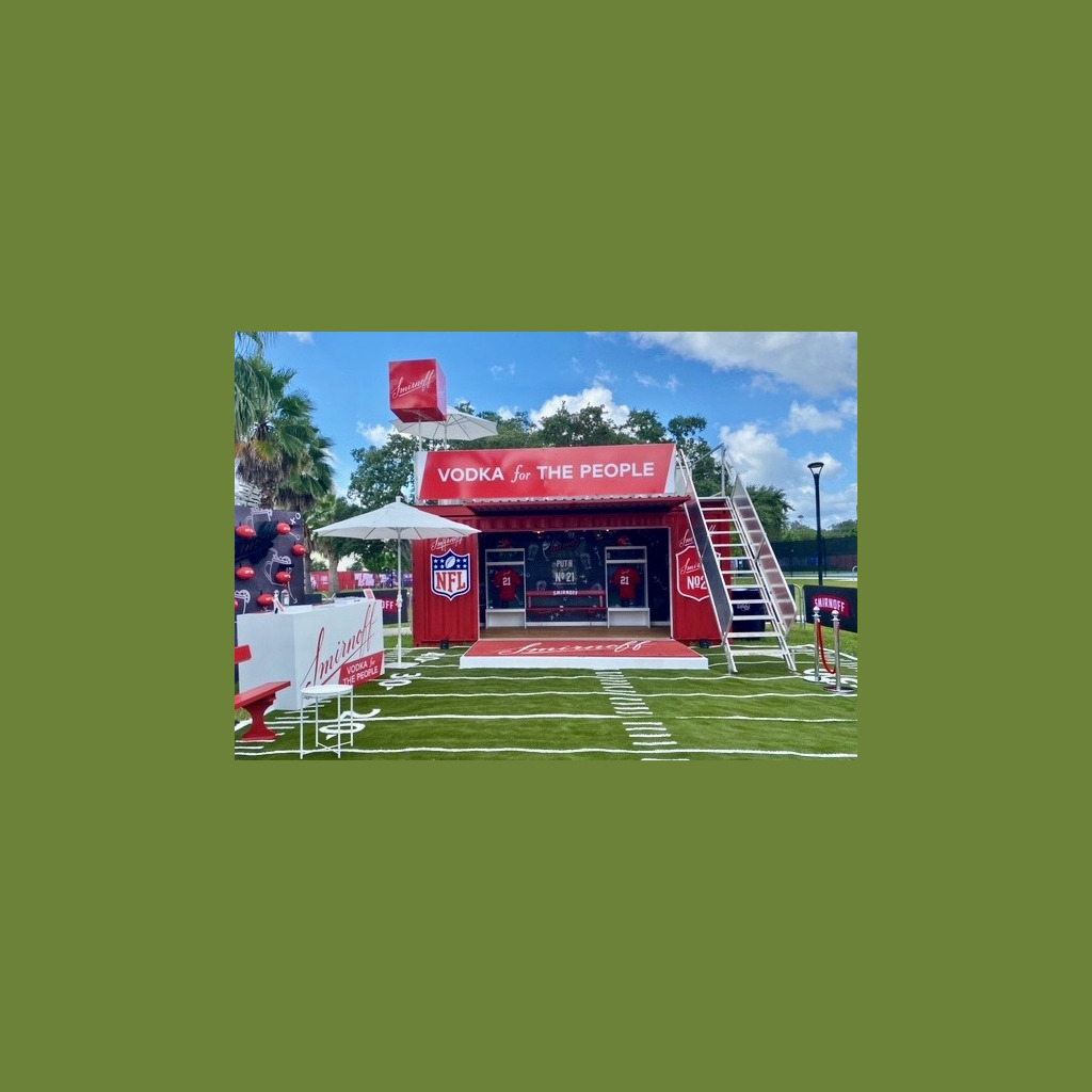 A red and white tent with an advertisement for the nfl.