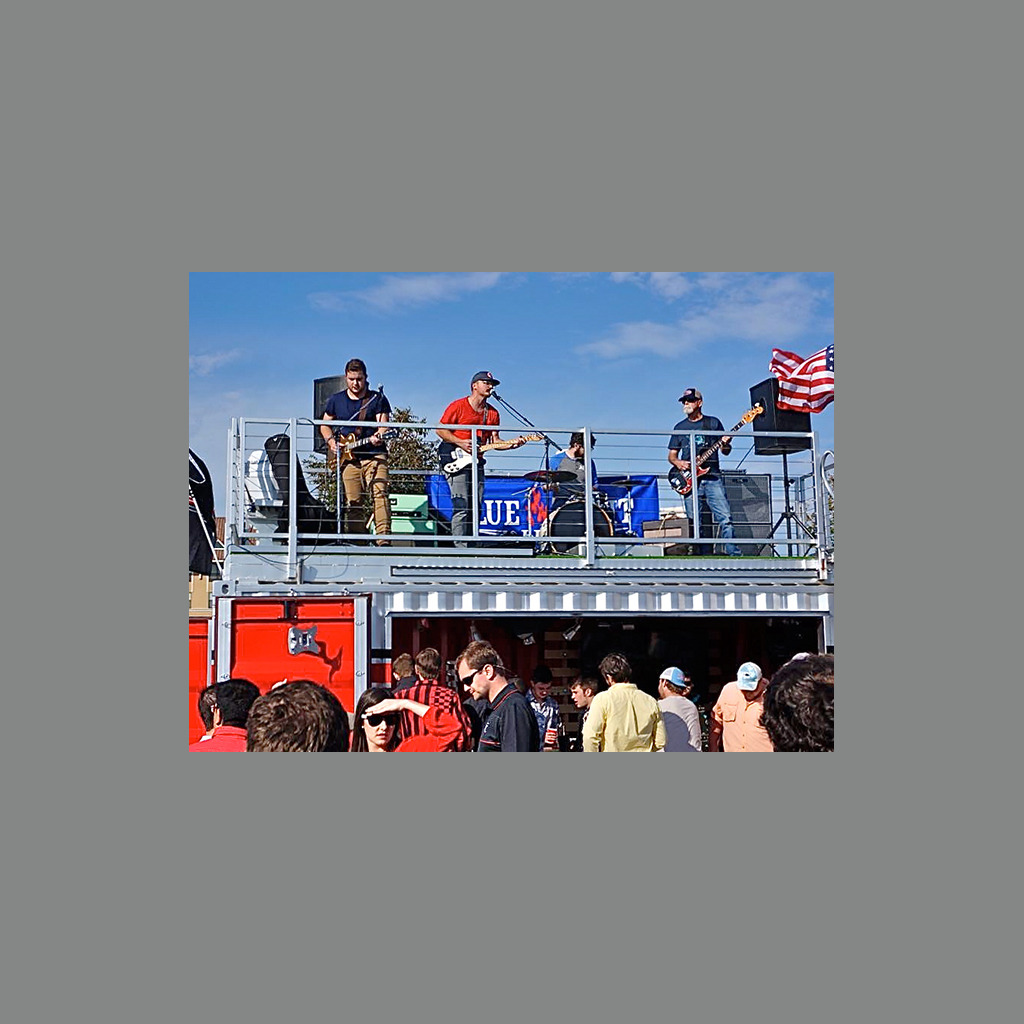 A group of people standing on top of a building.
