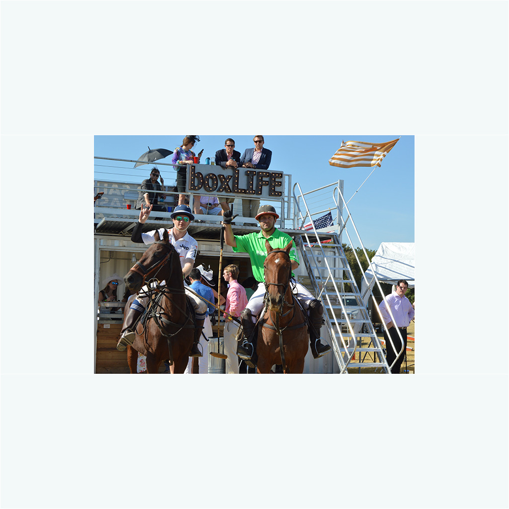 A man riding on the back of a brown horse.