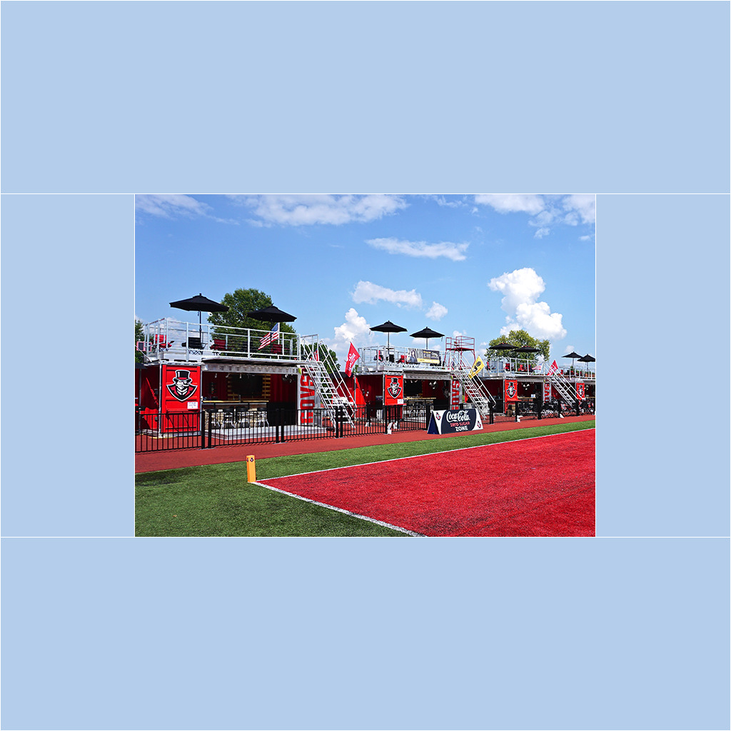 A red and white stadium with tables and chairs