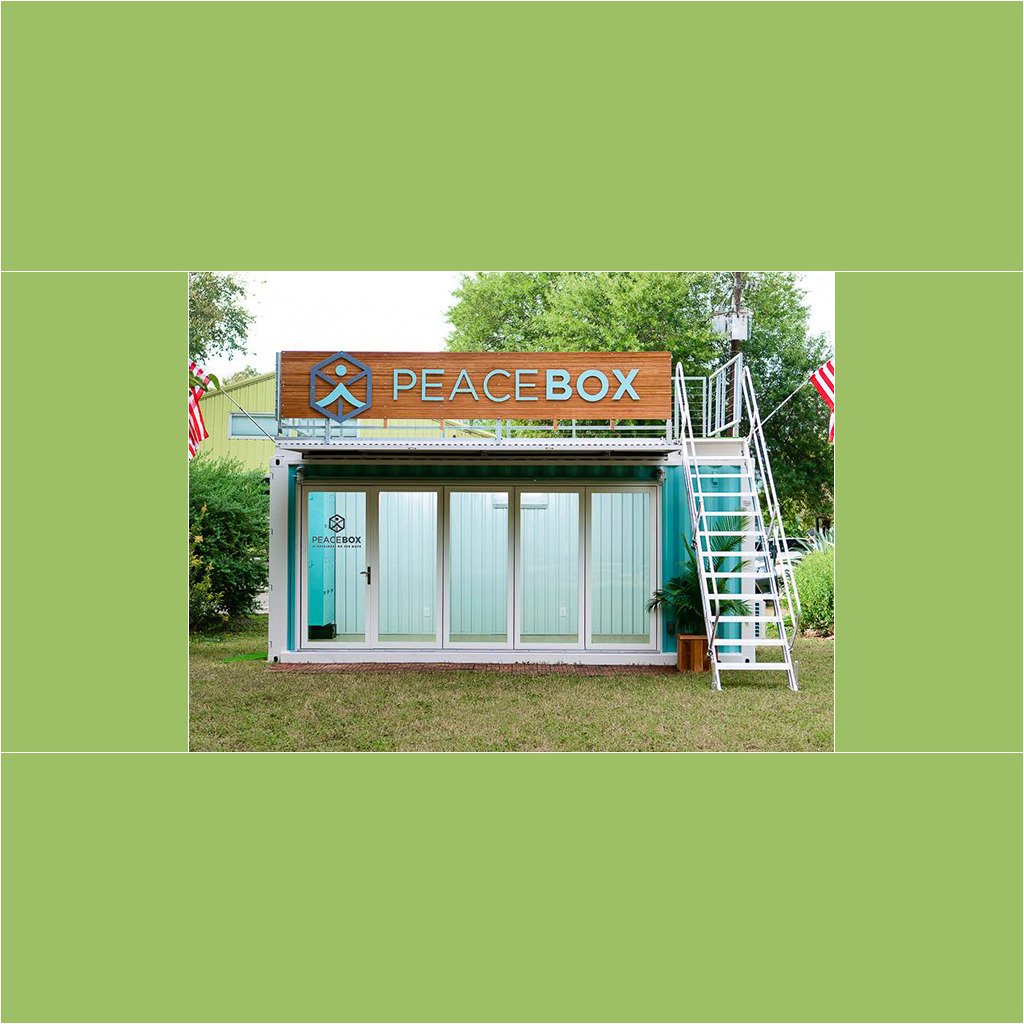 A large blue container with a sign on top of it.