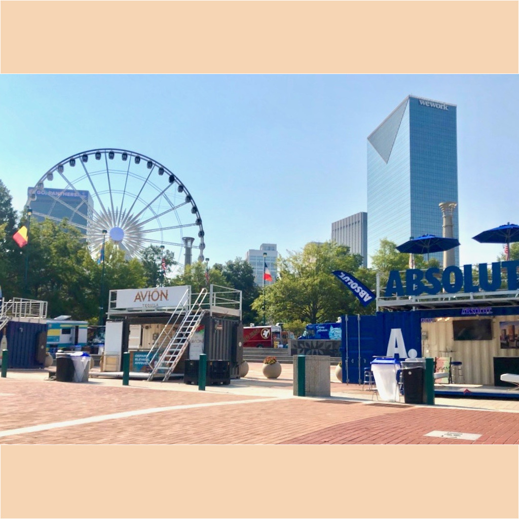 A ferris wheel and some buildings in the background