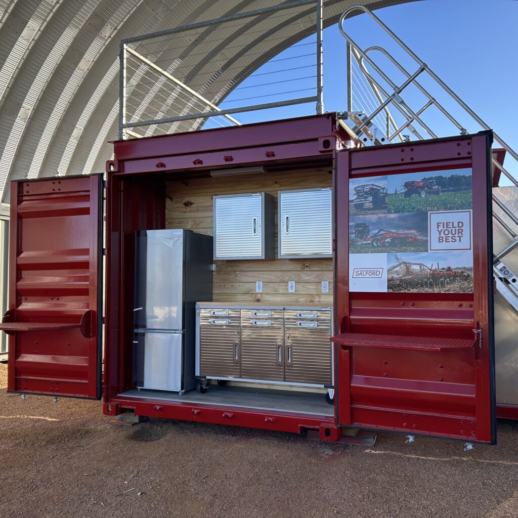 A red container with a refrigerator inside of it.