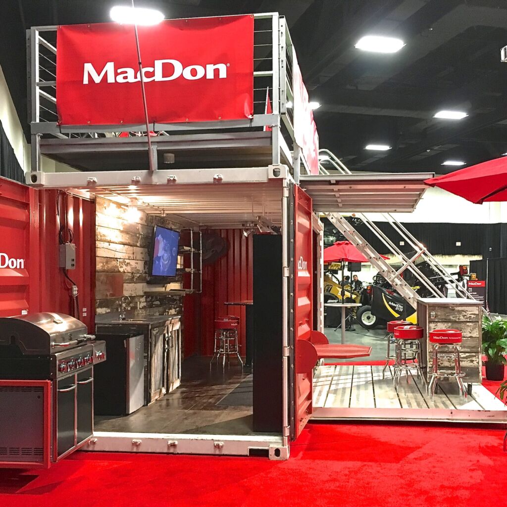 A red and white container with a grill on top of it.