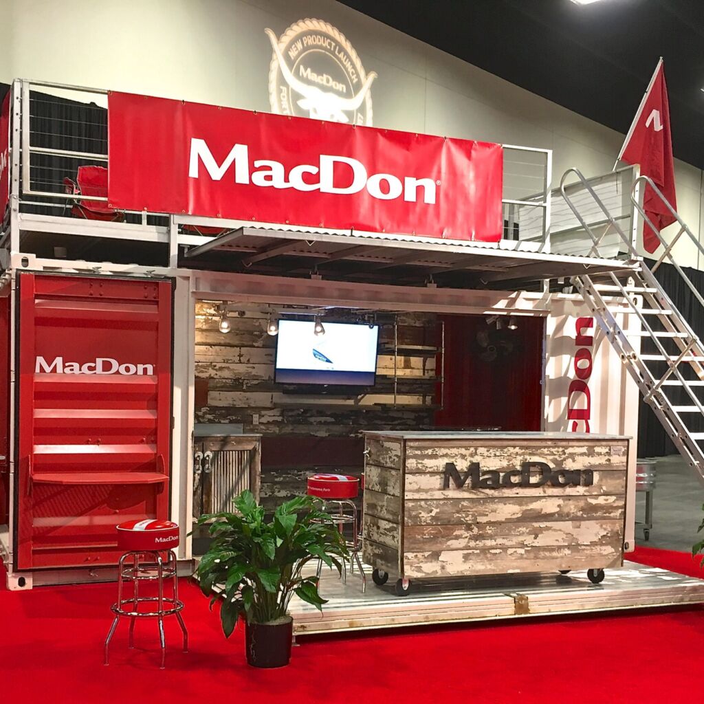 A red and white stand with a wooden counter