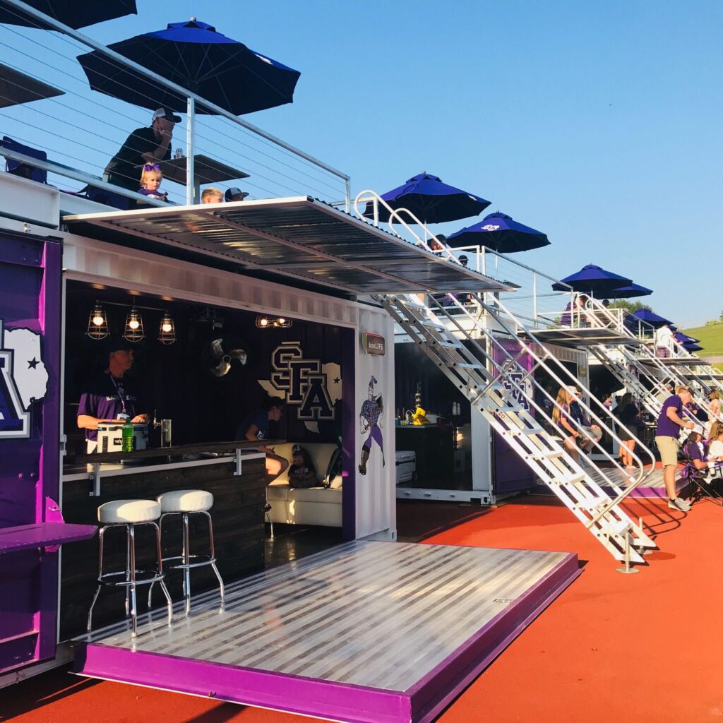 A stage with steps and chairs on top of it.