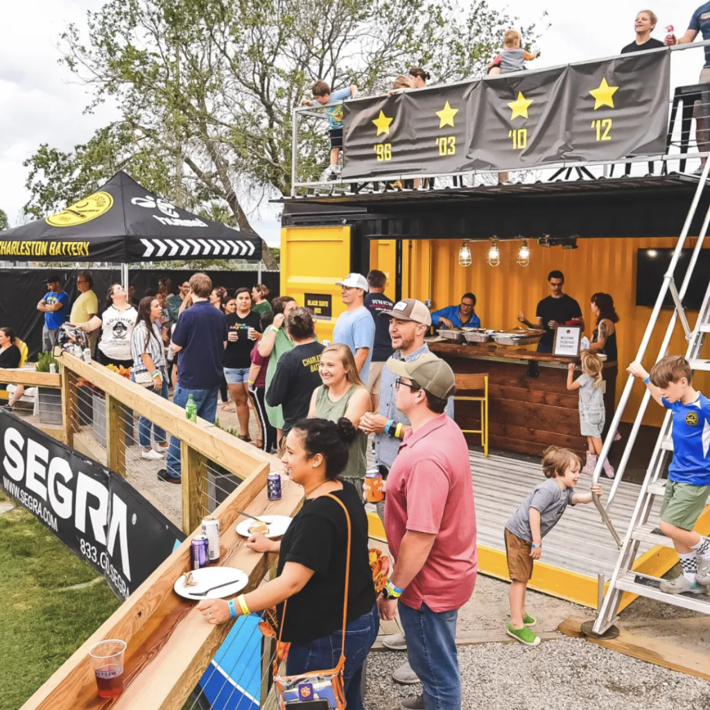 A crowd of people standing around at an event.