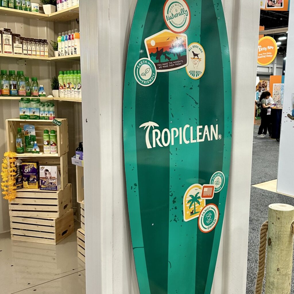 A surfboard sign in the shape of a surf board.