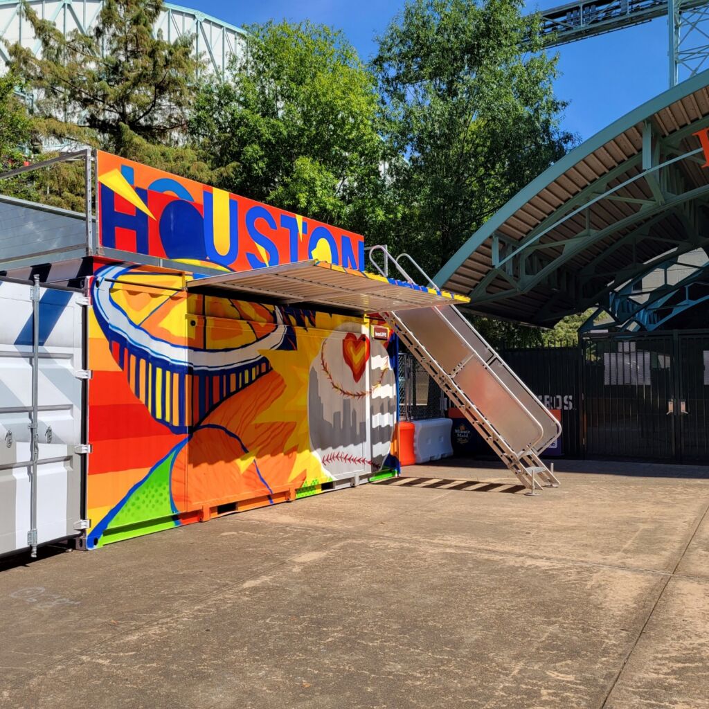 A large mural of an orange and a ramp