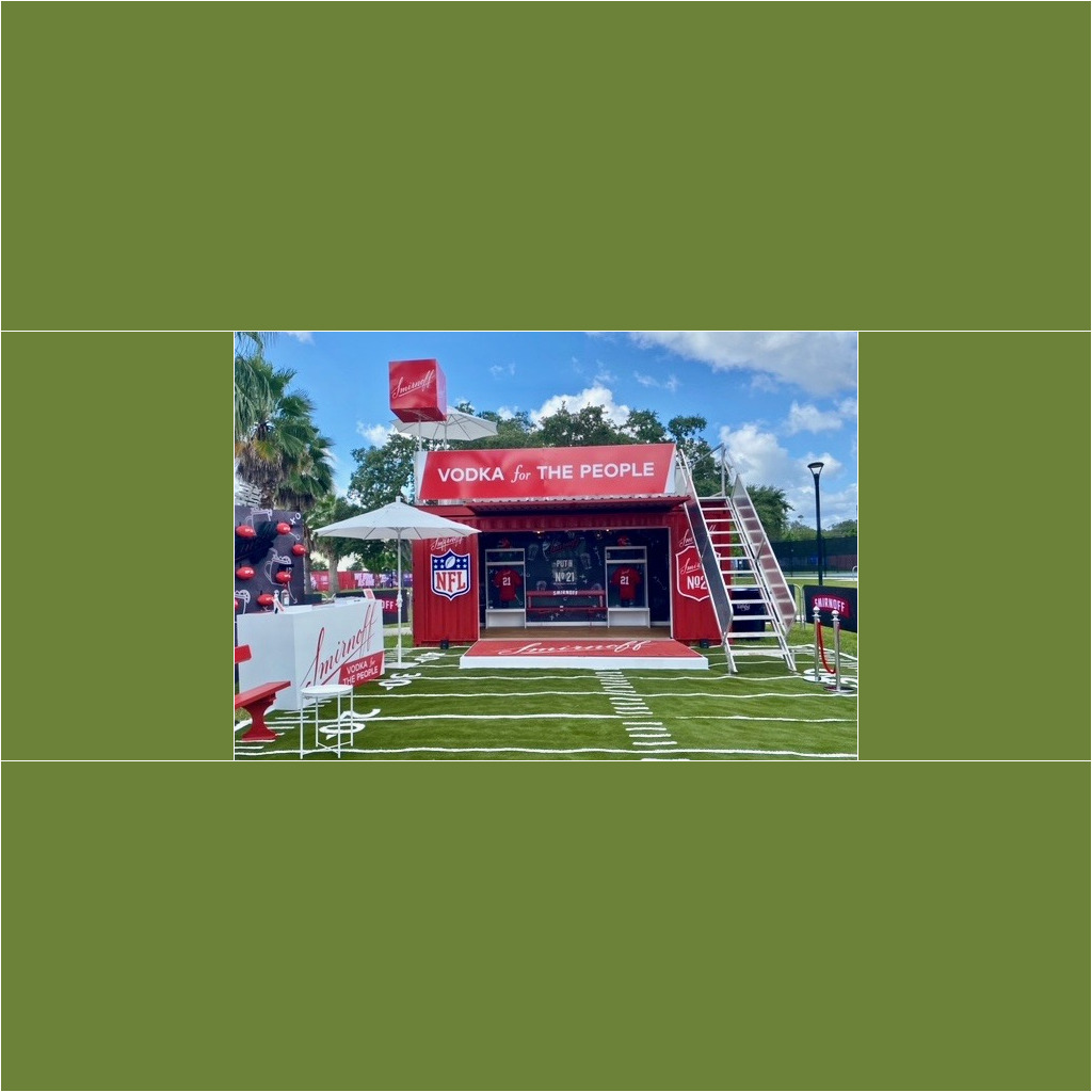 A red and white tent with an advertisement for the nfl.