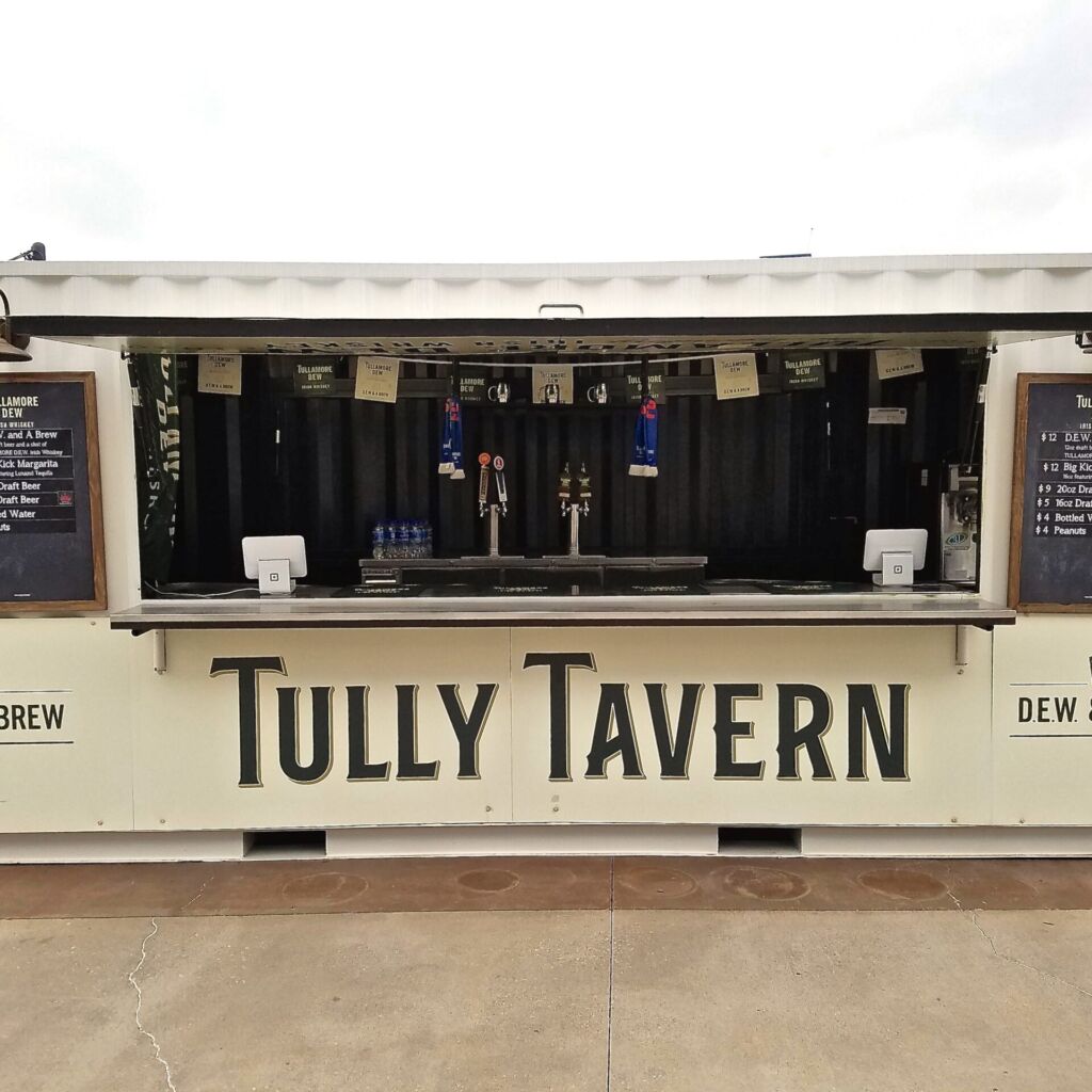 A bar with a sign that says tully tavern.